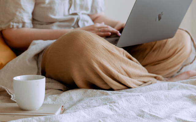 Lady typing on a laptop